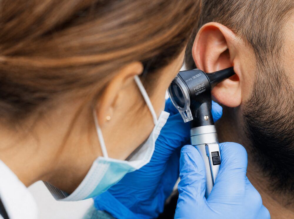 Ear canal examined with an otoscope before earwax removal at Advanced EARGEAR in Akron, OH