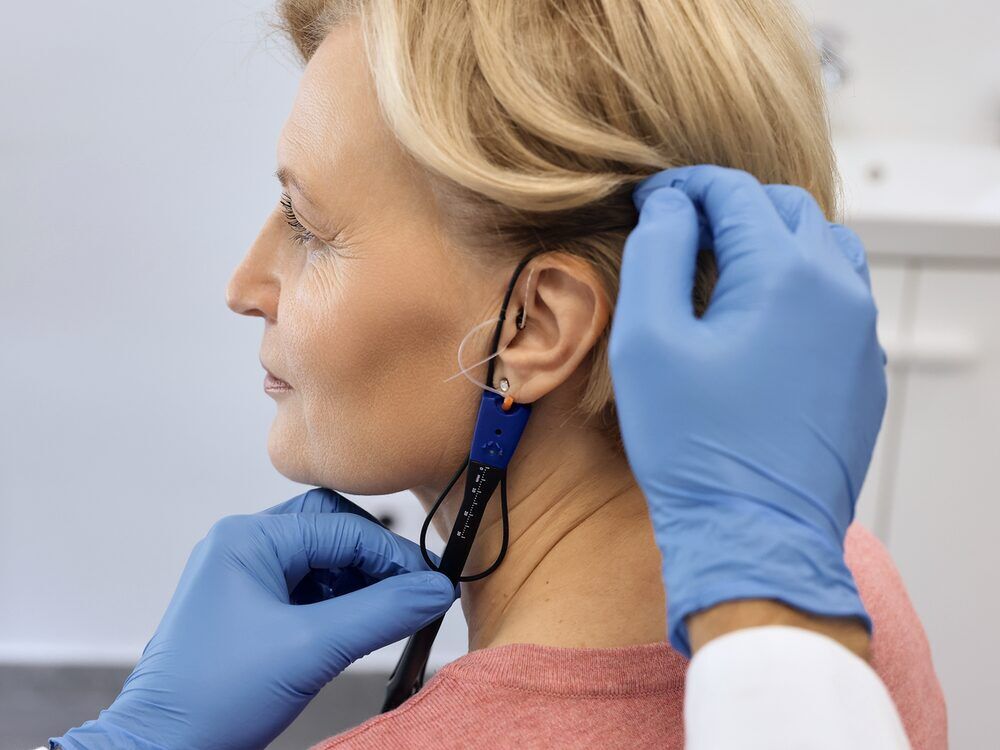 Real ear measurement probe microphone in place during a hearing aid fitting at Advanced EARGEAR in Akron, OH